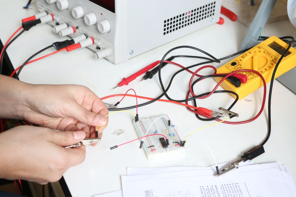 electrical-engineer-connecting-an-electric-circuit-542730599-5c2a7877c9e77c0001f4f79c.jpg
